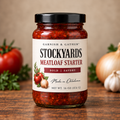 Garnish & Gather Stockyards Meatloaf Starter, 16 oz jar with a black lid and ivory label featuring tomato, onion, and herb artwork.