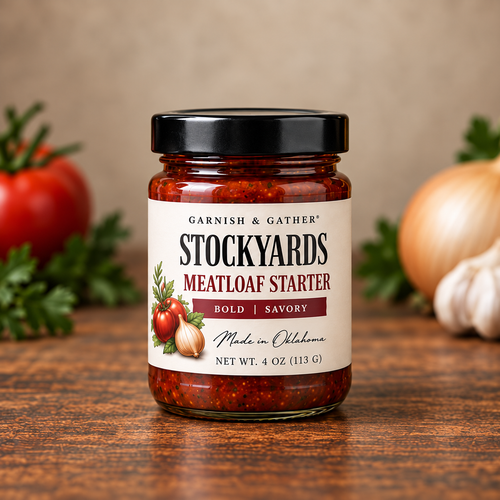 Garnish & Gather Stockyards Meatloaf Starter, 4 oz jar with a black lid and ivory label featuring tomato, onion, and herb artwork.