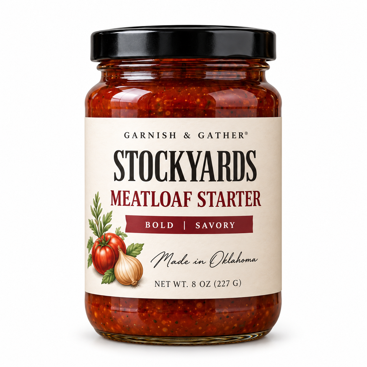 Garnish & Gather Stockyards Meatloaf Starter, 8 oz jar with a black lid and ivory label featuring tomato, onion, and herb artwork.